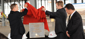 2011- First Solar CEO Rob Gillette and Mesa, Ariz., Vice Mayor Scott Somers unveil a ceremonial marker commemorating construction progress for the company's new factory.