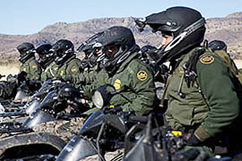 Border Patrol agents line up in formation on motor bikes in the Tucson sector.