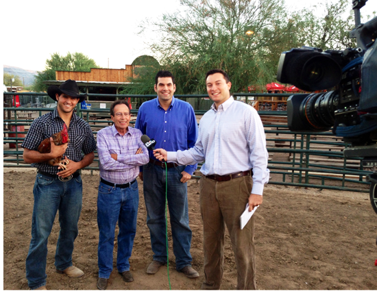  Rose Law Group attorney Vice Mayor Adam Trenk, Mayor Vince Francia and Town Manager Rodney Glassman are seen with a Channel 12 reporter doing a story on why Cave Creek is the West’s Most Western Town. Scottsdale was represented by the proxy chicken.  