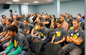 Solar installers wear t-shirts supporting their industry at ACC hearing. / Kyle O'Donnell/Cronkite News