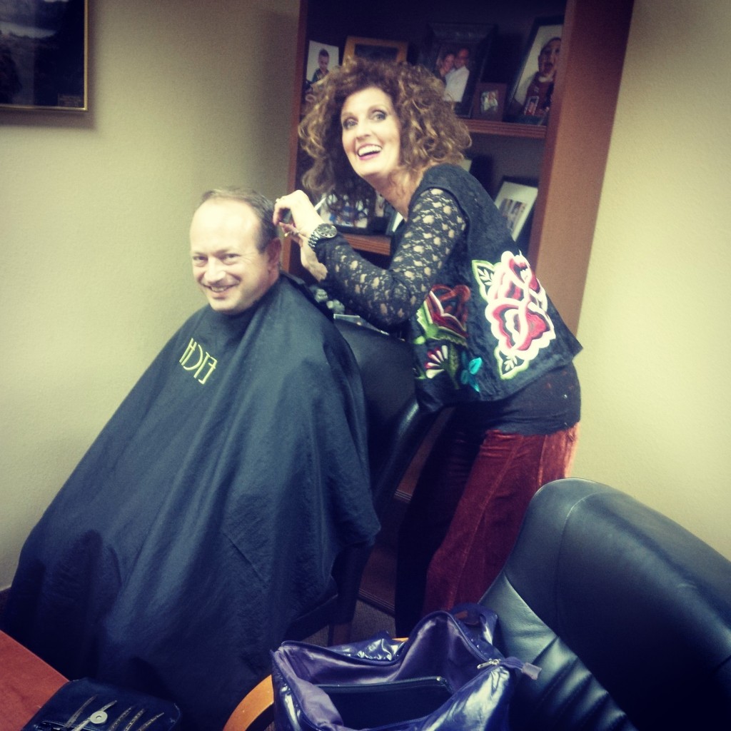 Ron Hatcher getting an in office haircut by Lynn Felix