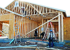 A construction crew with United Construction Group builds a home Thursday afternoon at the Granville subdivion in Prescott Valley. :Cindy Barks:The Daily Courier