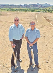 Paul Schneider of Remax Mountain Properties, left, and David Everson President of Mandalay Homes stand together in the lot that will become the first home built at the new Granite Dells / Matt Hinshaw/The Daily Courier