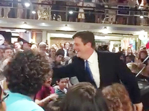 Mayor Stanton high-fives well-wishers after his re-election Tuesday./Facebook