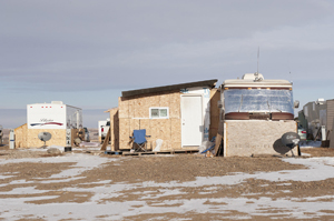 For permanent RV residents in the oil field, space is at a premium. Some enterprising owners build mud rooms that rival the trailers they are attached to in size, like this on at Fox Run RV Park in Williston, North Dakota.