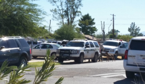Authorities search a property in the 4500 Block of South Liberty Avenue in Tucson Thursday. The search is connected to a $2.8 million dollar money laundering, drug trafficking and fraud of state benefits case. (Source: Tucson News Now)