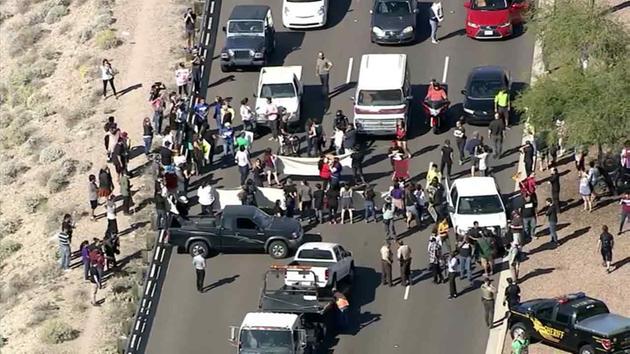 Protesters block a street leading into Phoenix, Ariz., where Donald Trump was set to hold a campaign rally on Saturday, March 19, 2016.