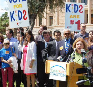 Dana Wolfe Naimark, president and CEO of Children’s Action Alliance, leads a news conference in support of KidsCare.