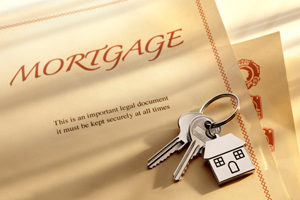 House door key with mortgage documents