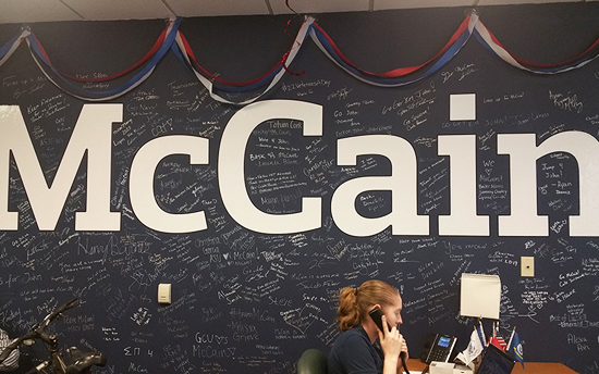 A McCain intern answers questions at Phoenix campaign headquarters. /Photo by Socorro Carrillo/Cronkite News