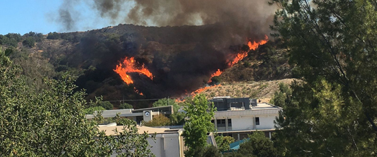 A brush fire burns in the City of Calabasas in Los Angeles County