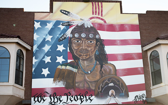 Mural of a Native American on the side of a trading post that sold goods from tribes on the Navajo Nation near Gallup, New Mexico. /Mike Lakusiak/News21