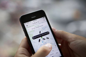 Th Uber Technologies Inc. car service app in 2014. :PHOTO- BLOOMBERG NEWS
